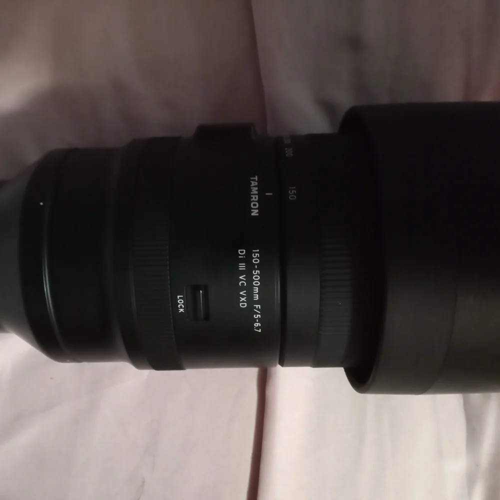 Black Telephoto Zoom Lens with Textured Focusing Ring and Robust Construction